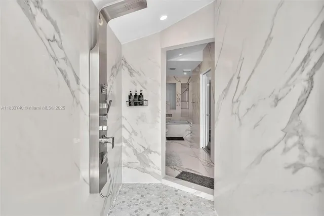 a bedroom with a bed and flat screen tv