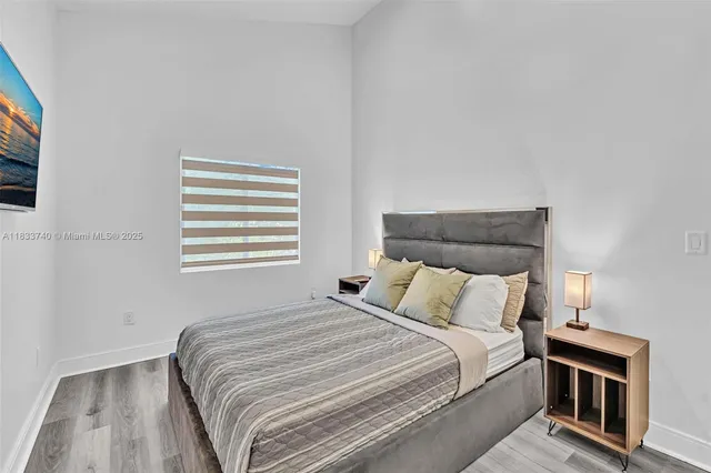 a bathroom with a granite countertop sink a toilet and a mirror