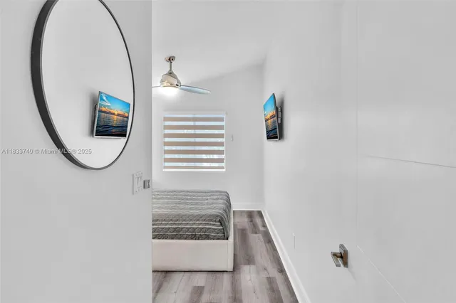 an aerial view of a house with a yard and sitting area