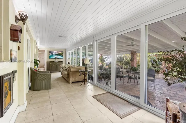 a lobby with furniture and floor to ceiling window
