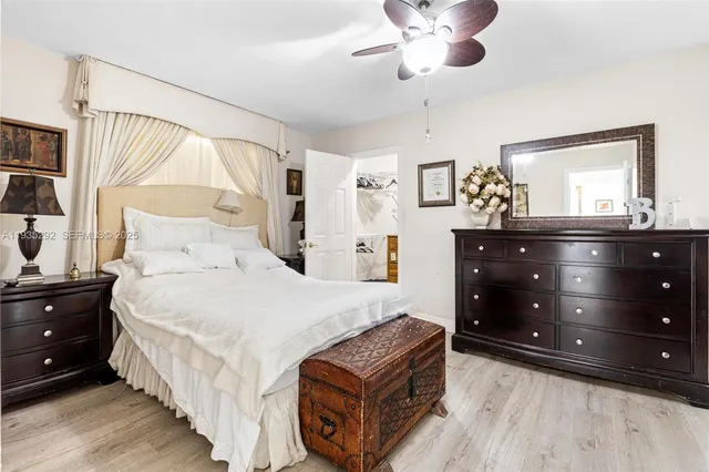 a bedroom with a bed and a dresser