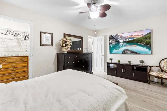 a bed room with a bed and a television