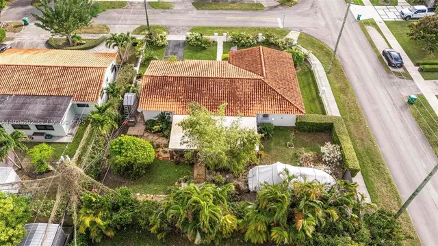 an aerial view of a house with swimming pool