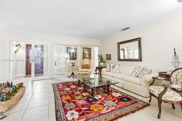 a living room with furniture and a rug