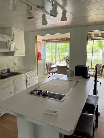 a view of a kitchen with a large window
