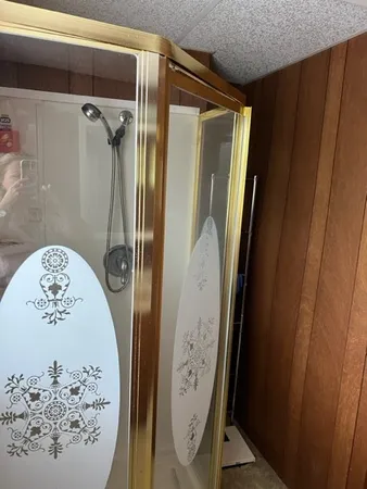 a view of bathroom with a mirror