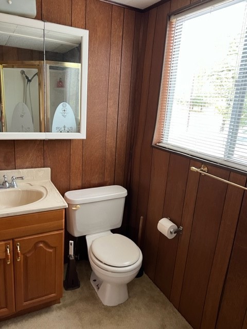 29 Thomas Lake Road Huntsville, TX 77320 - Photo 20 of 43 a bathroom with a toilet a sink and a window