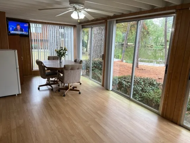 a view of a dining room with furniture window and outside view