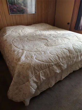 a bedroom with a bed and a cabinets