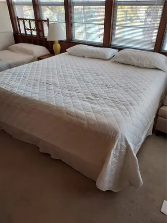 a bedroom with bed and window