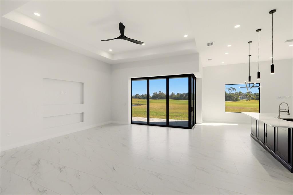 17 Long Meadow Road Rotonda West, FL 33947 - Photo 6 of 37 a view of an empty room with a window