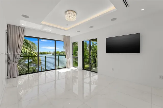 a view of a livingroom with furniture window and front door