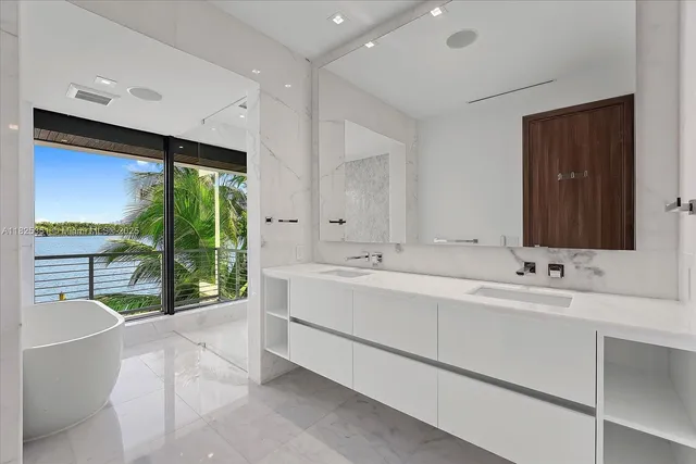a bathroom with a bathtub and window