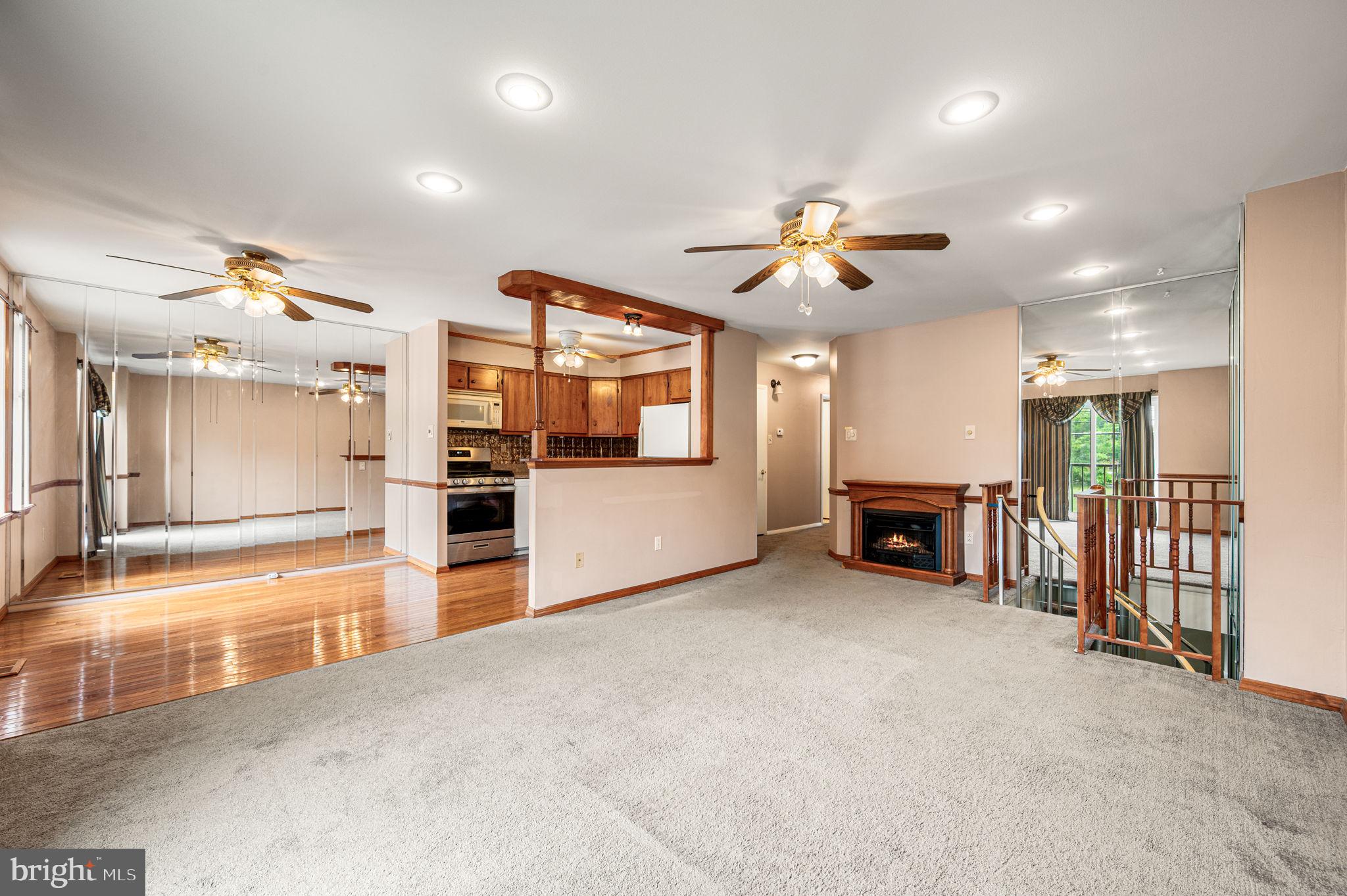9578 State Rd., Unit A Philadelphia, PA 19114 - Photo 5 of 27 a view of a livingroom with furniture a ceiling fan and window