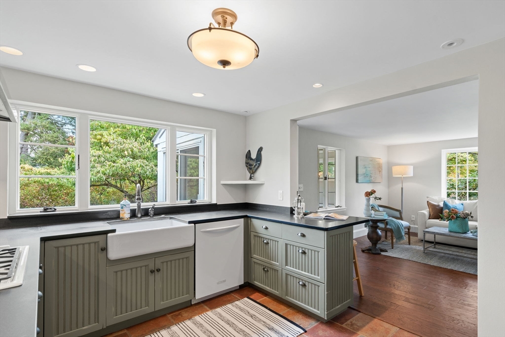232 Sudbury Road Concord, MA 01742 - Photo 15 of 35 a kitchen with a sink stove and cabinets
