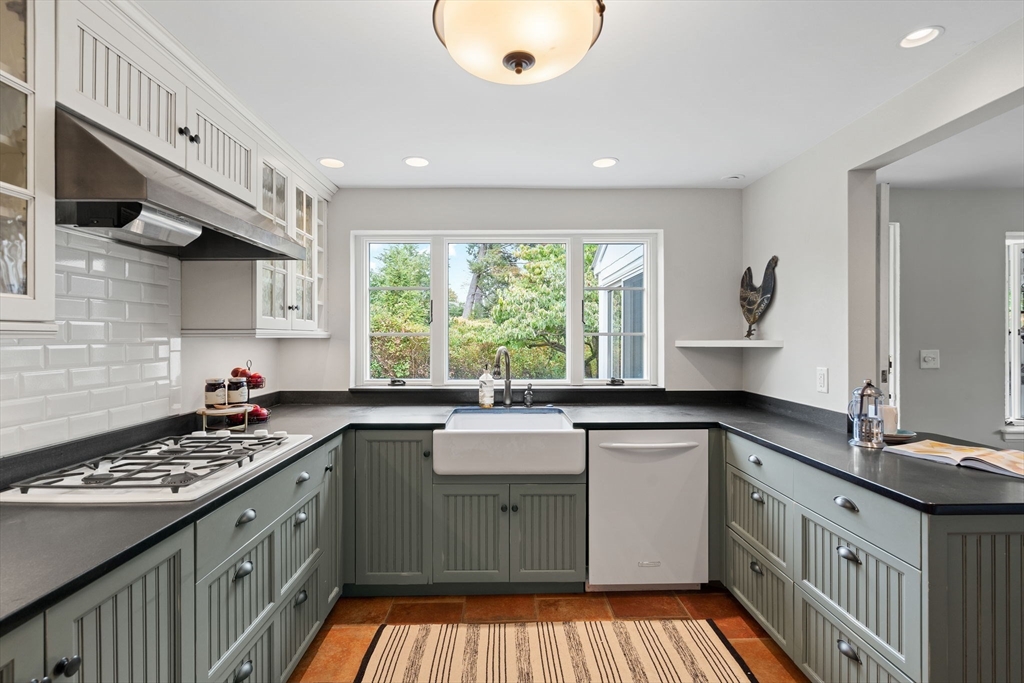 232 Sudbury Road Concord, MA 01742 - Photo 16 of 35 a kitchen with a sink stove and cabinets