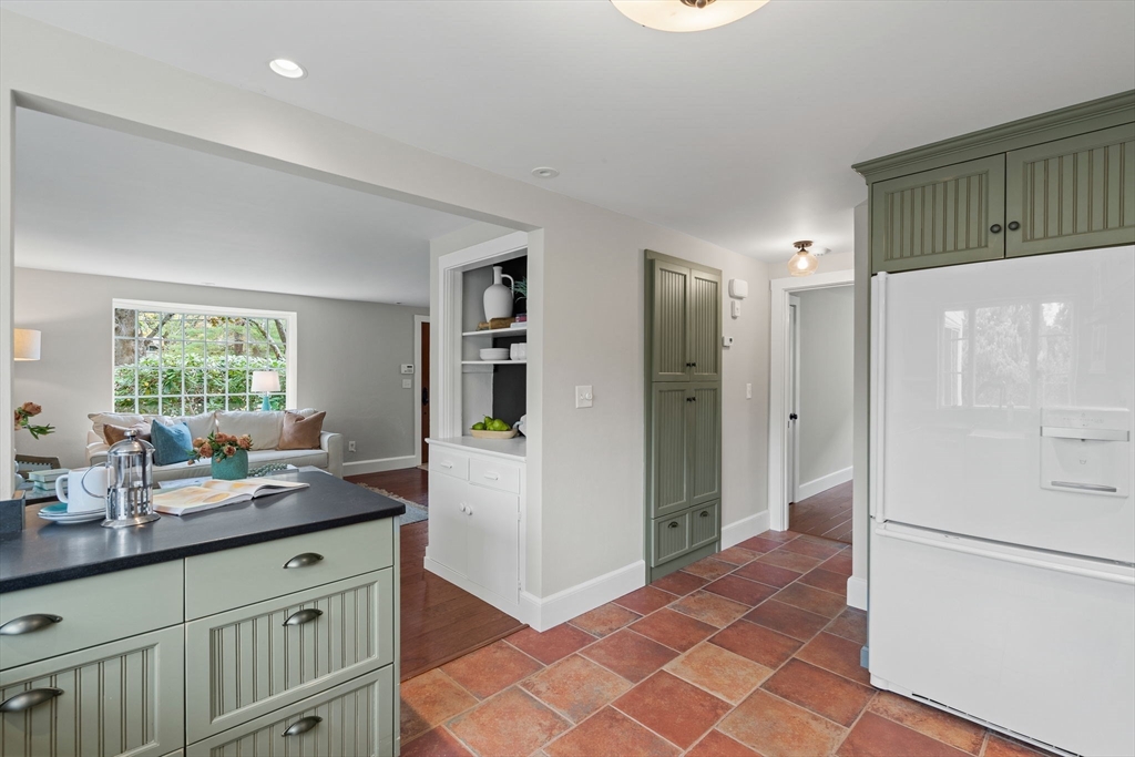 232 Sudbury Road Concord, MA 01742 - Photo 17 of 35 a kitchen with granite countertop a refrigerator and a sink
