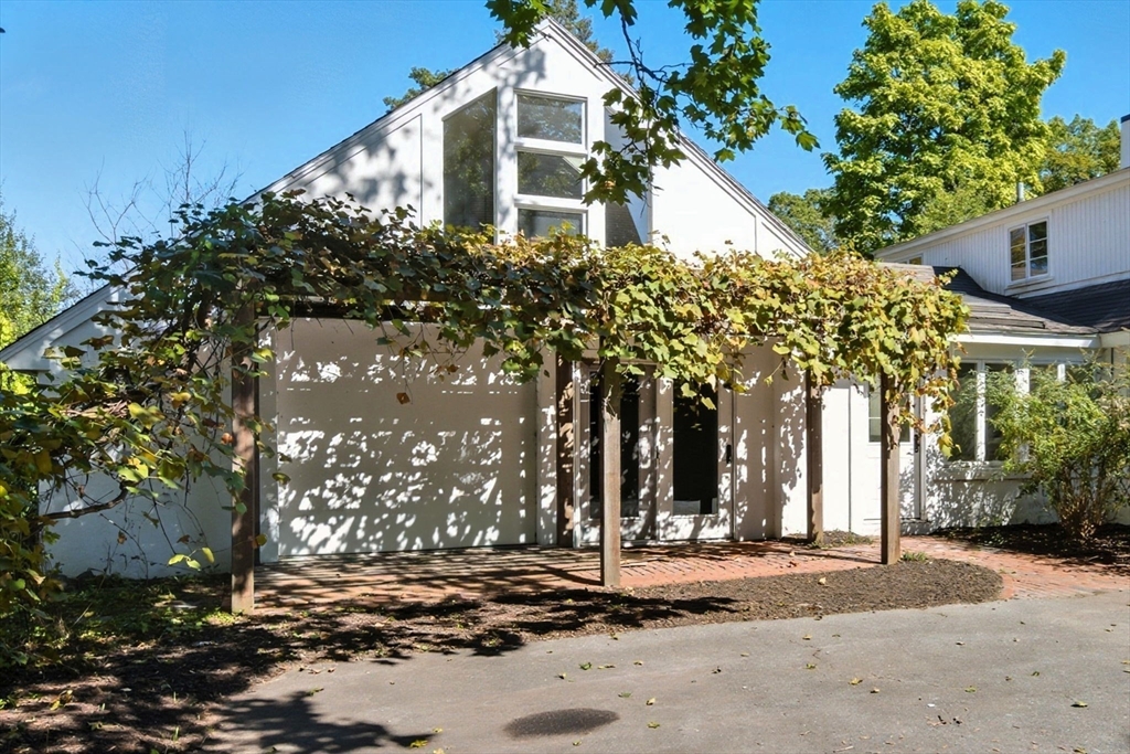 232 Sudbury Road Concord, MA 01742 - Photo 2 of 35 a couple of palm trees in front of house