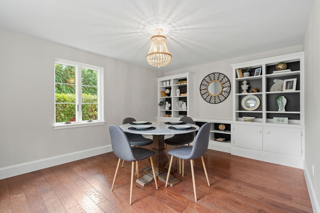 232 Sudbury Road Concord, MA 01742 - Photo 6 of 35 a view of a dining room with furniture clock and wooden floor
