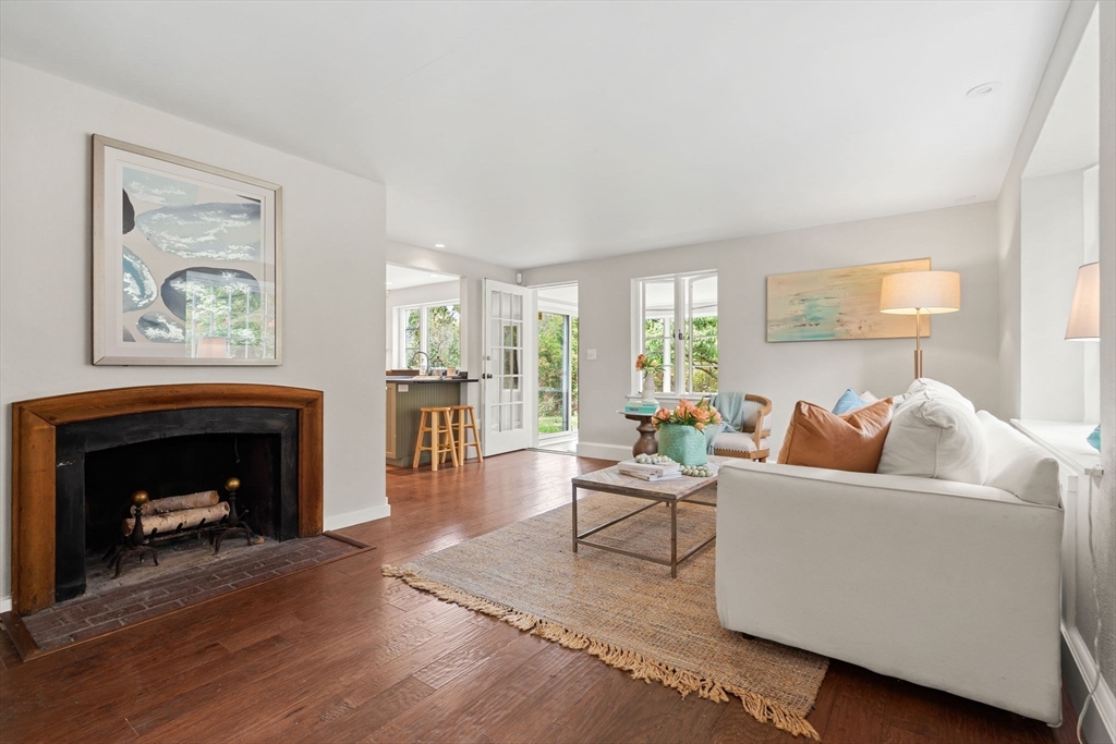 232 Sudbury Road Concord, MA 01742 - Photo 7 of 35 a living room with furniture and a fireplace