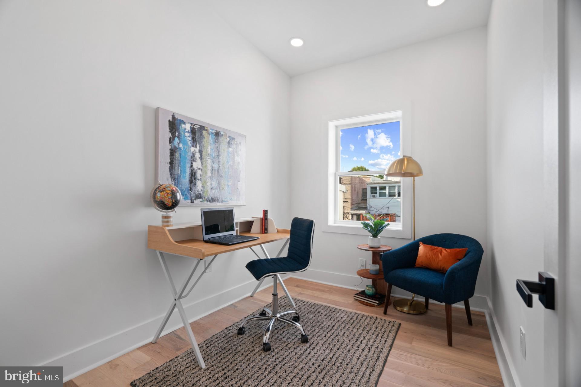 445 Decatur Street Northwest Washington, DC 20011 - Photo 14 of 28 a workspace with furniture and wooden floor