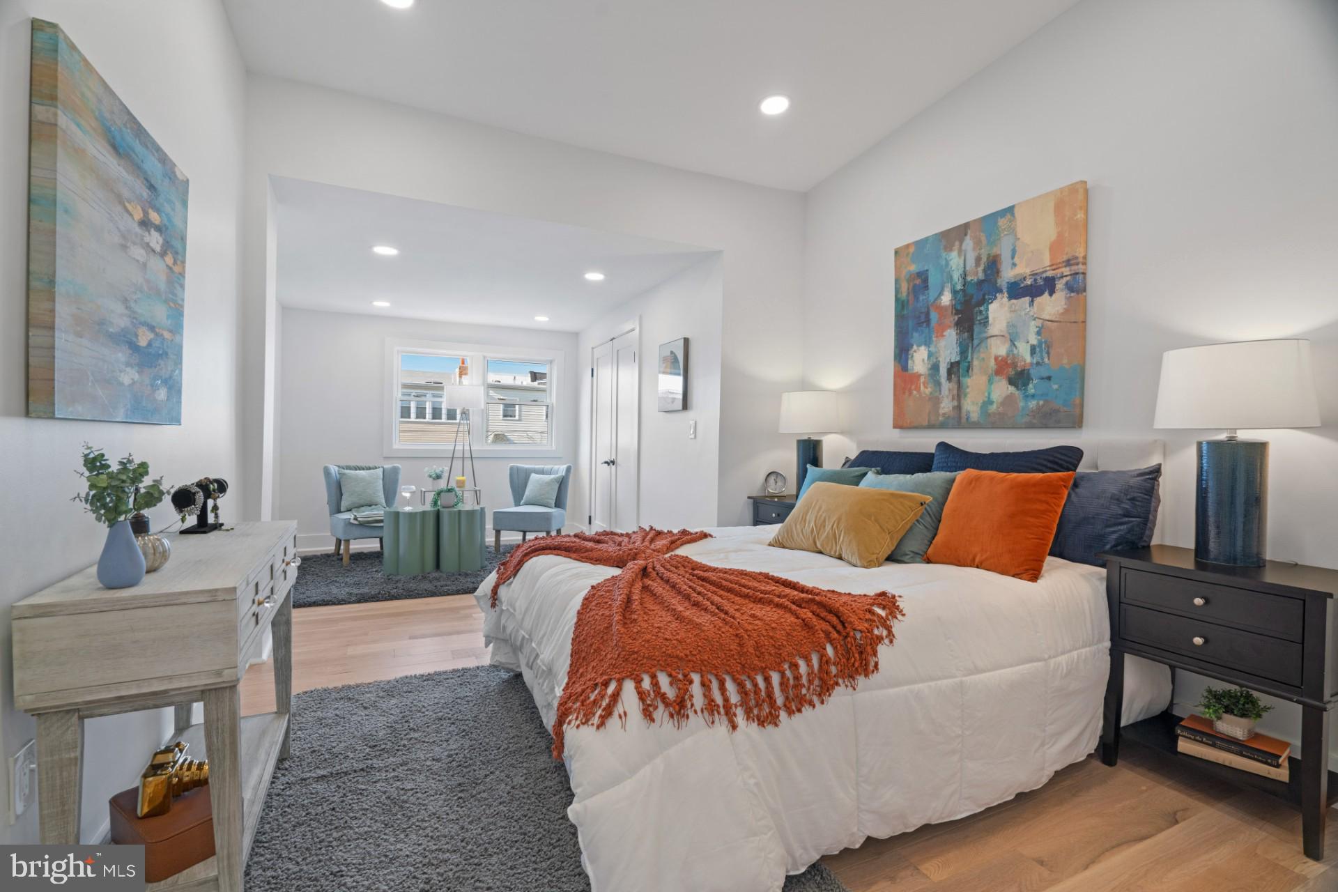 445 Decatur Street Northwest Washington, DC 20011 - Photo 15 of 28 a spacious bedroom with a bed and a couch