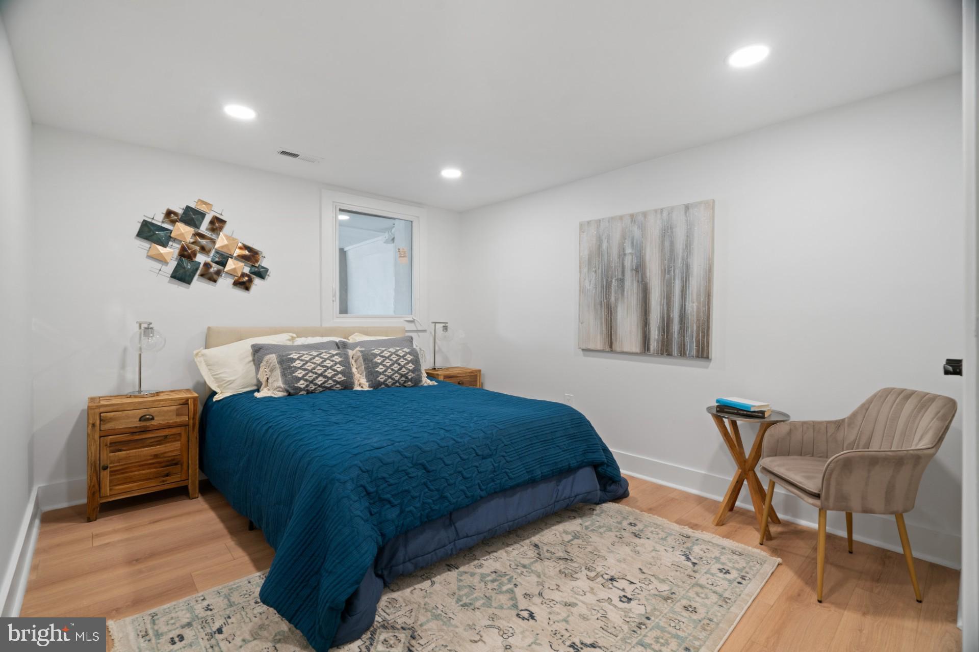 445 Decatur Street Northwest Washington, DC 20011 - Photo 18 of 28 a bedroom with a bed and a chair
