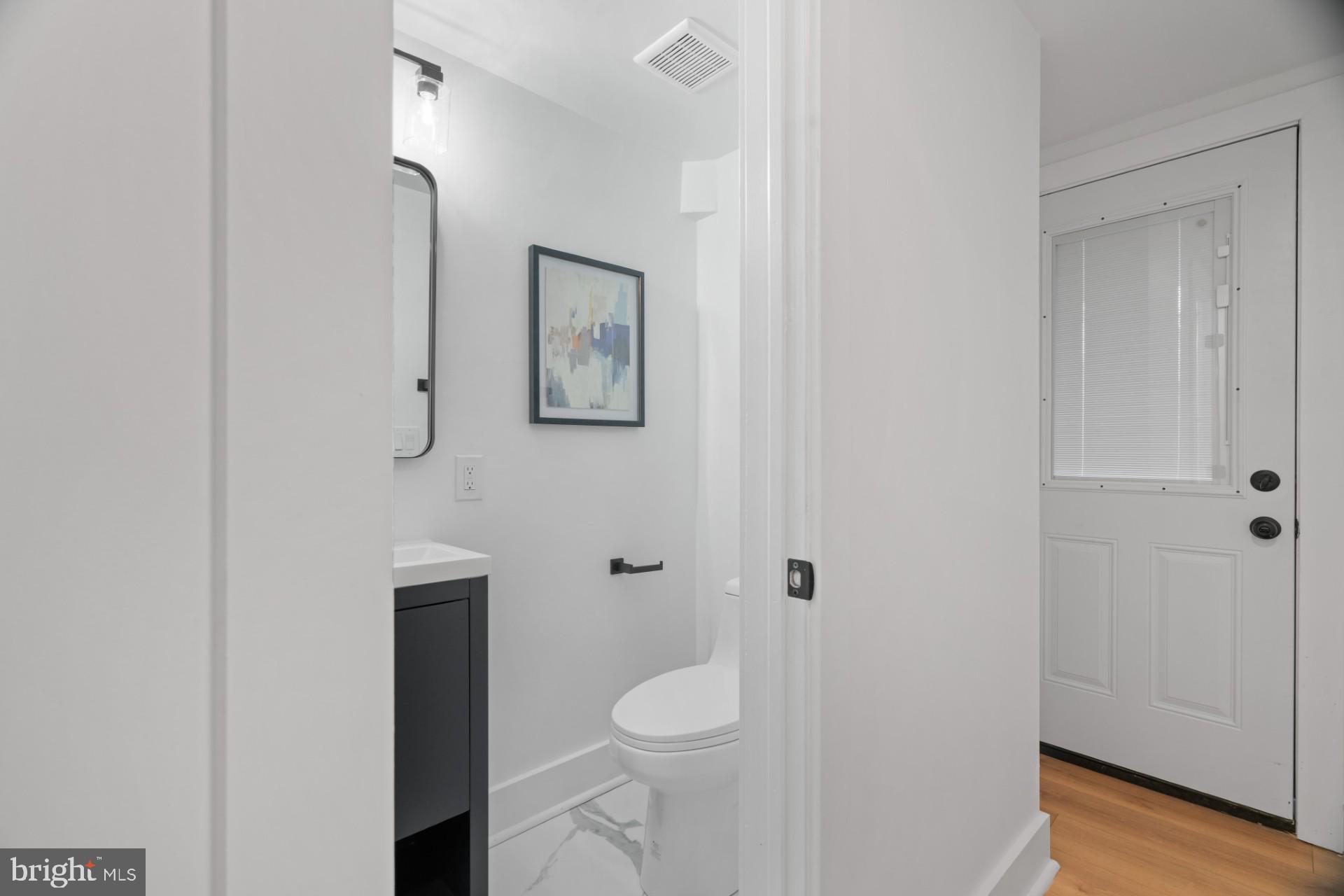 445 Decatur Street Northwest Washington, DC 20011 - Photo 20 of 28 a bathroom with a toilet sink and shower