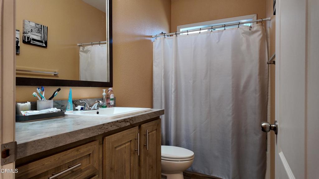 3900 North State Street, Unit 56 Ukiah, CA 95482 - Photo 13 of 29 a bathroom with a sink a toilet and shower