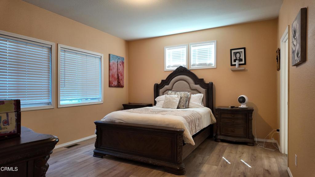 3900 North State Street, Unit 56 Ukiah, CA 95482 - Photo 14 of 29 a bedroom with a bed and wooden floor