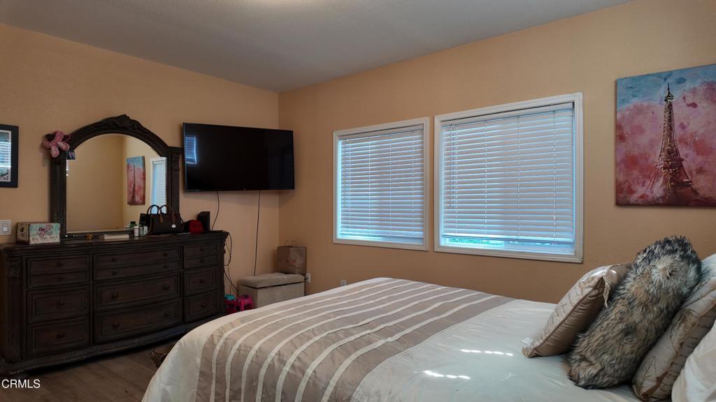 3900 North State Street, Unit 56 Ukiah, CA 95482 - Photo 15 of 29 a bedroom with a bed and a flat screen tv