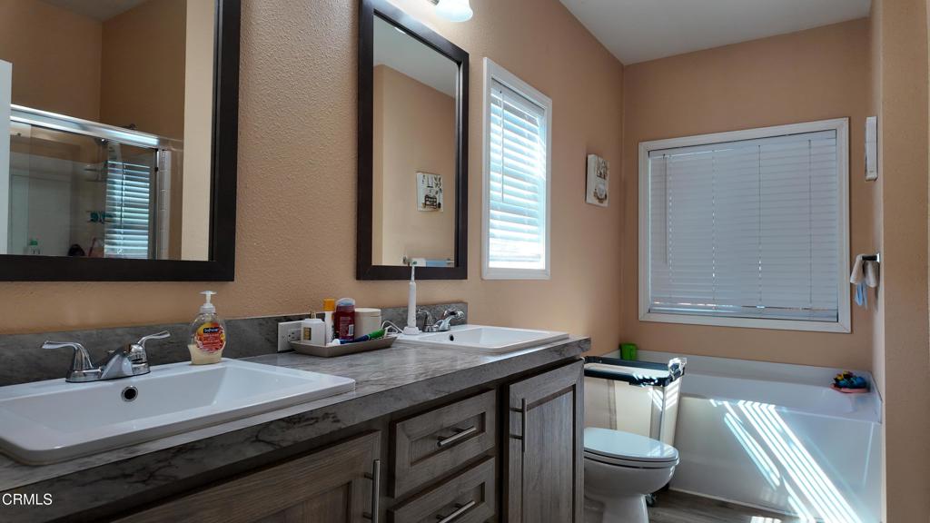 3900 North State Street, Unit 56 Ukiah, CA 95482 - Photo 16 of 29 a bathroom with a double vanity sink and a mirror