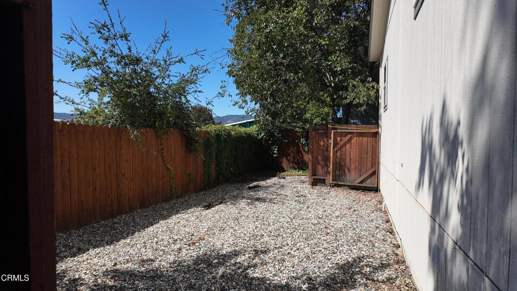 3900 North State Street, Unit 56 Ukiah, CA 95482 - Photo 24 of 29 a backyard of a house with lots of green space
