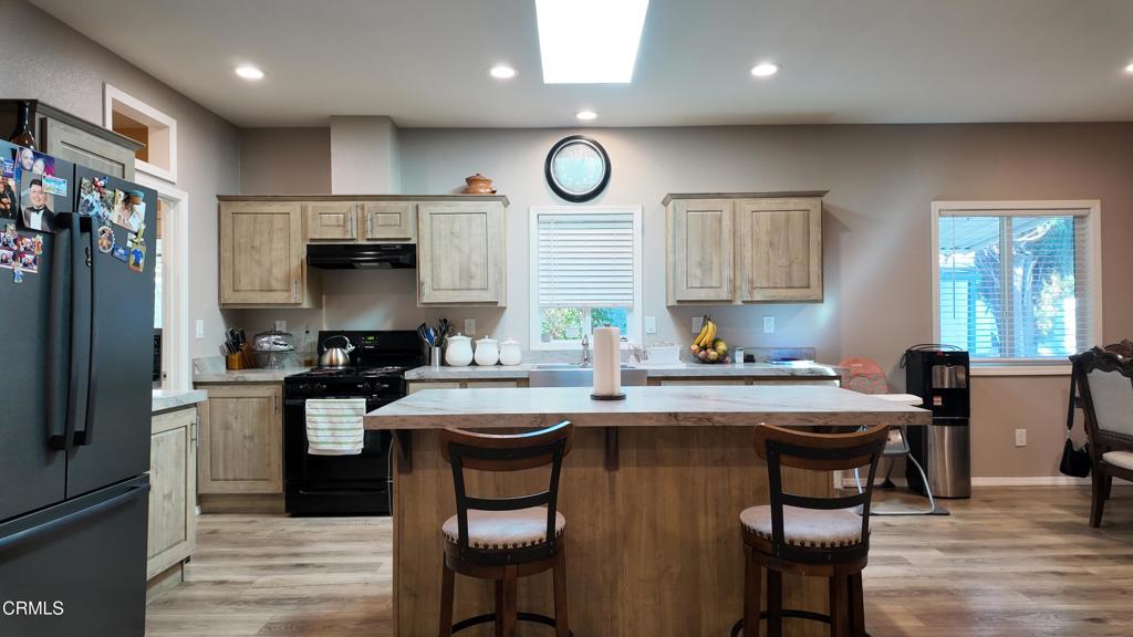 3900 North State Street, Unit 56 Ukiah, CA 95482 - Photo 6 of 29 a kitchen with granite countertop a sink appliances cabinets and furniture