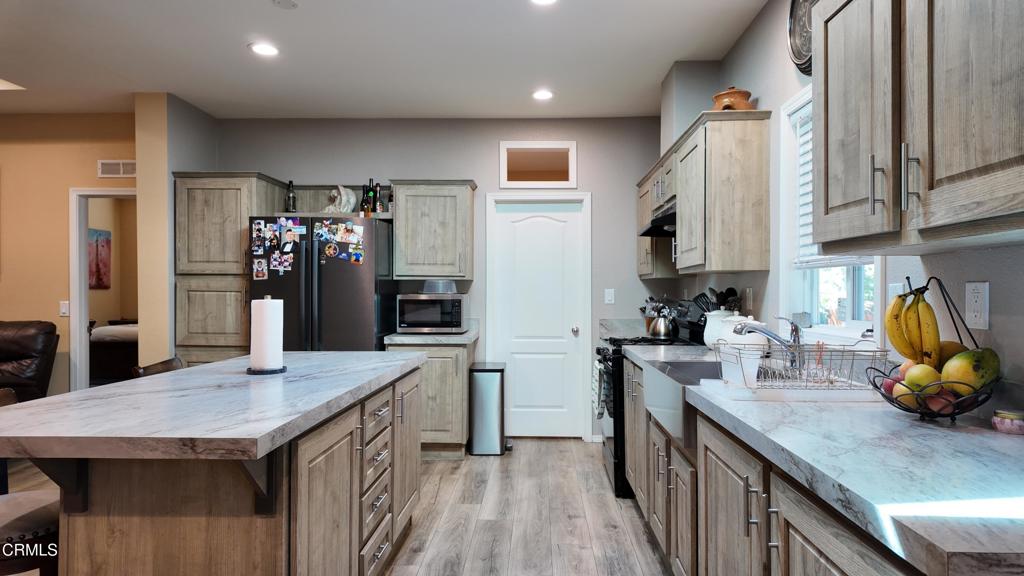 3900 North State Street, Unit 56 Ukiah, CA 95482 - Photo 7 of 29 a kitchen with a sink stove and refrigerator