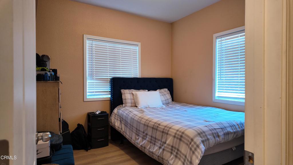 3900 North State Street, Unit 56 Ukiah, CA 95482 - Photo 10 of 29 a bedroom with a bed and wooden floor