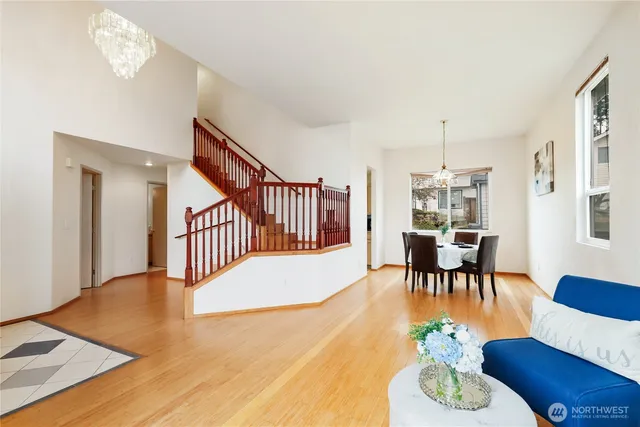 a view of a dining room with furniture and wooden floor