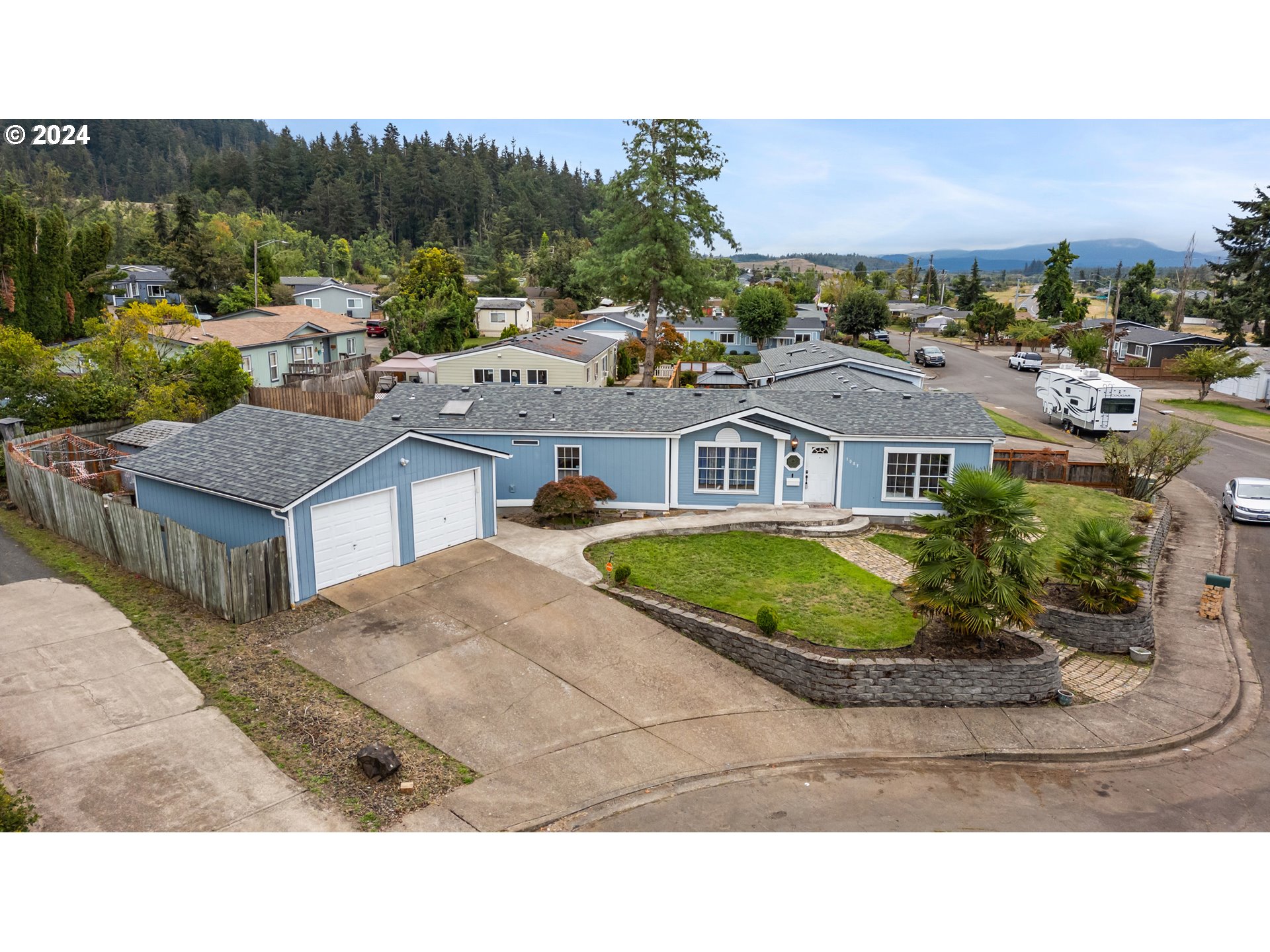 a aerial view of a house with a garden