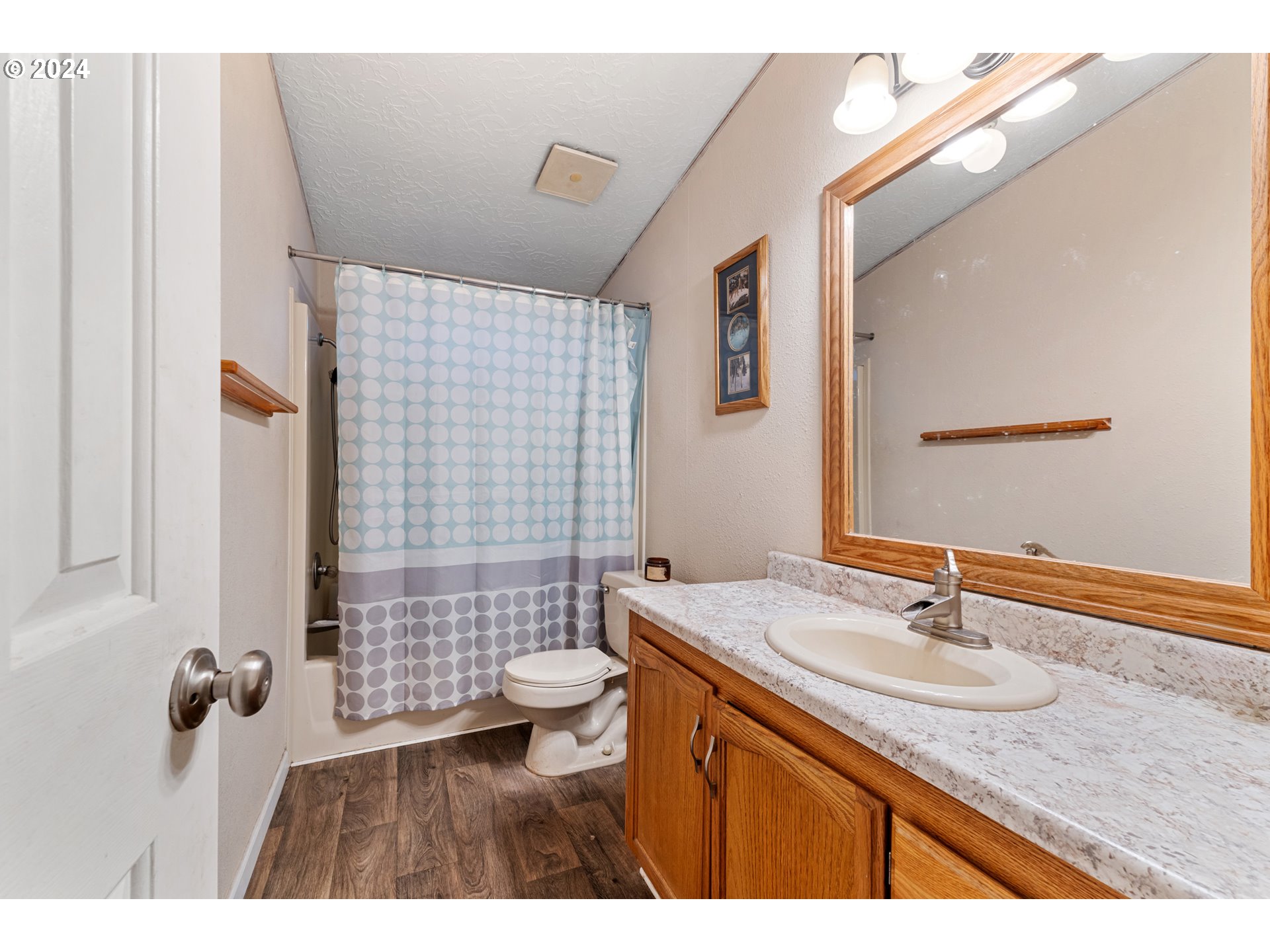 1083 South 59th Street Springfield, OR 97478 - Photo 23 of 29 a bathroom with a sink a toilet a mirror and shower