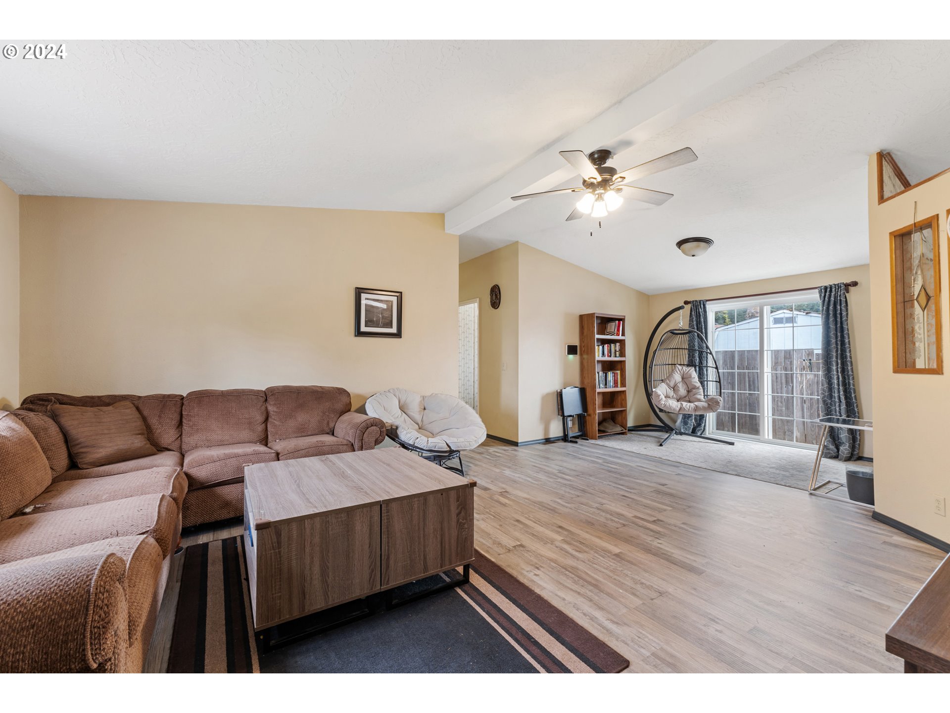 1083 South 59th Street Springfield, OR 97478 - Photo 6 of 29 a living room with furniture ceiling fan and a window