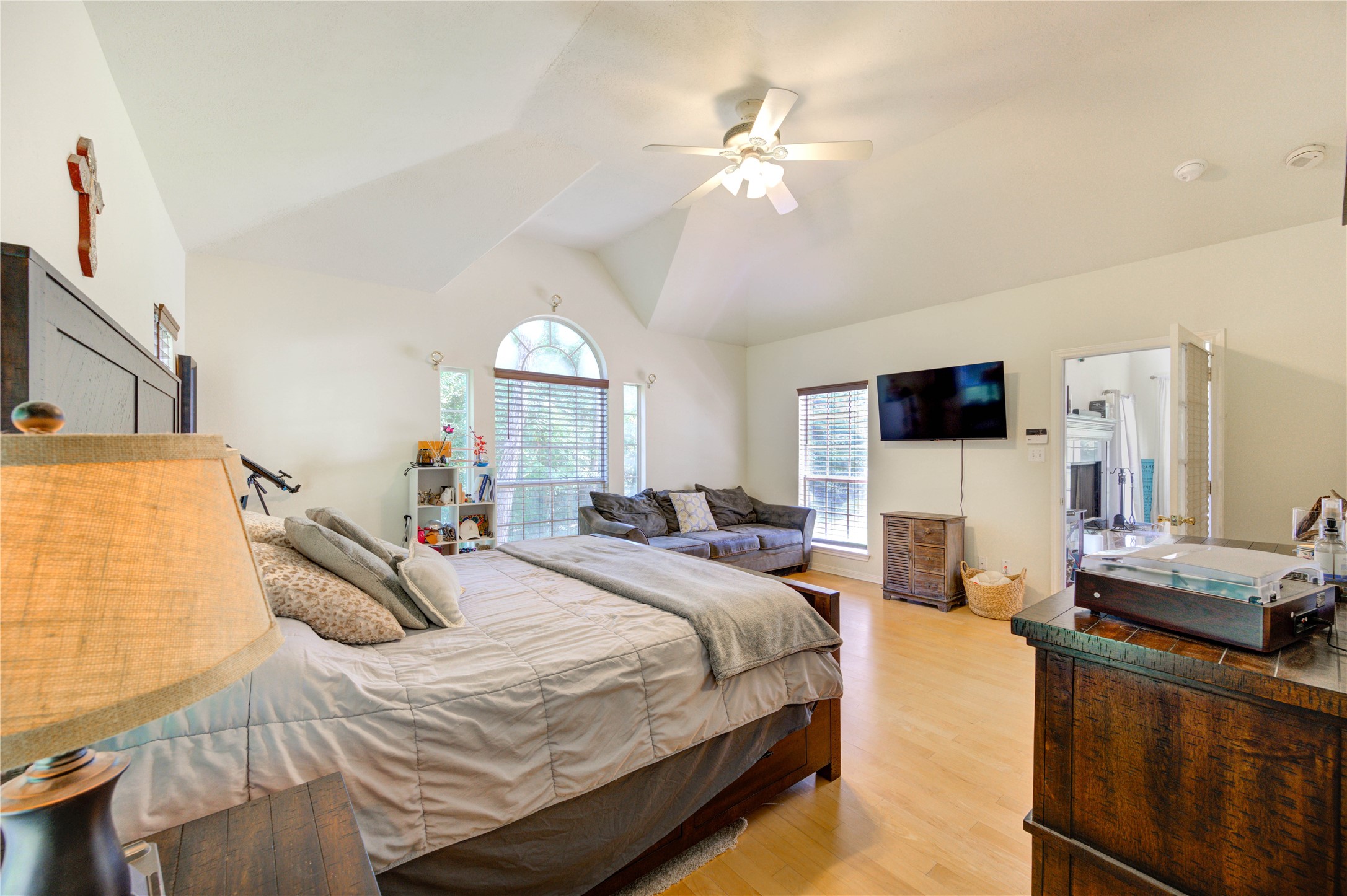 25903 Penguin Street Magnolia, TX 77355 - Photo 11 of 46 a bedroom with a bed and a chandelier