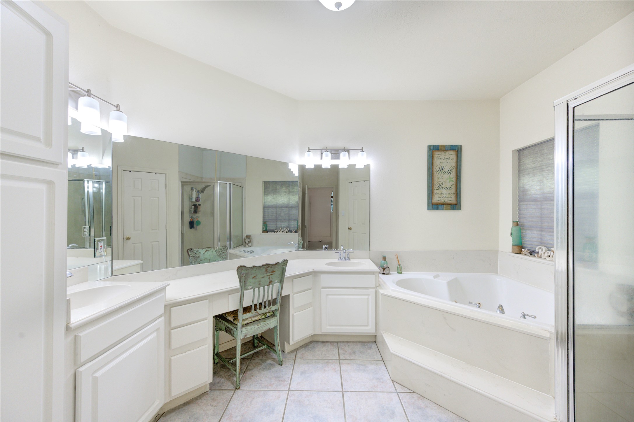 25903 Penguin Street Magnolia, TX 77355 - Photo 15 of 46 a bathroom with a bathtub shower sink and mirror