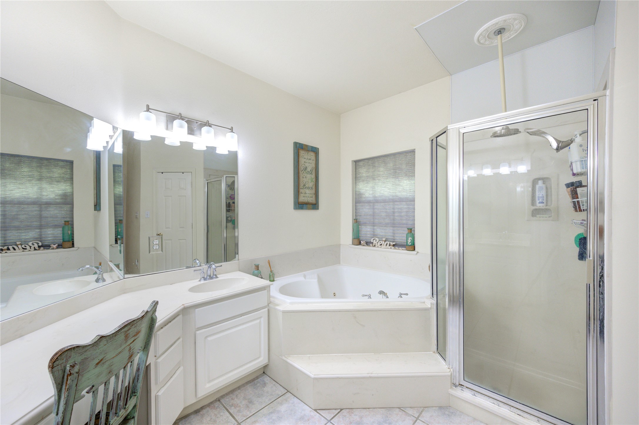 25903 Penguin Street Magnolia, TX 77355 - Photo 17 of 46 a bathroom with a double vanity sink mirror and shower