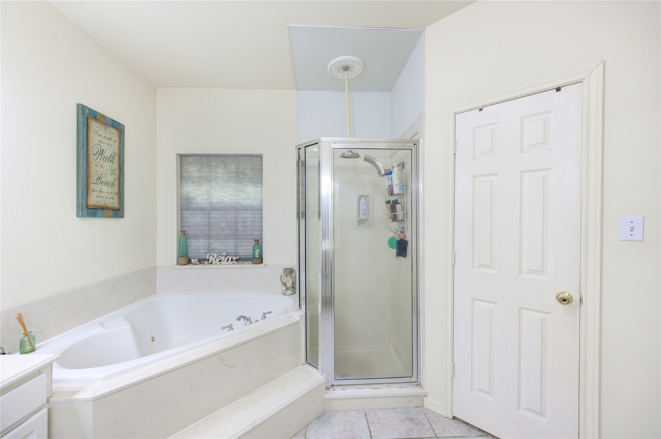 25903 Penguin Street Magnolia, TX 77355 - Photo 18 of 46 a bathroom with a bathtub and a shower