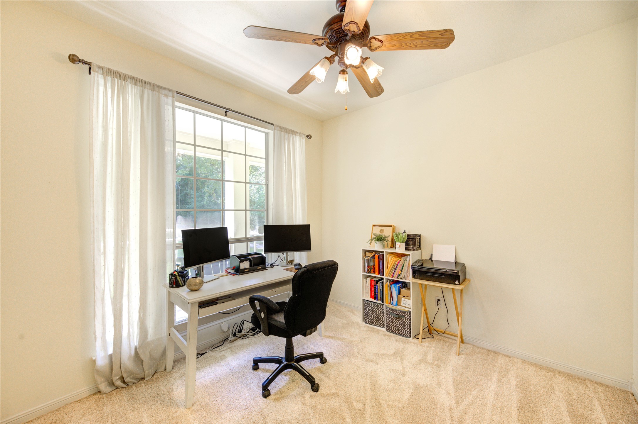 25903 Penguin Street Magnolia, TX 77355 - Photo 22 of 46 a view of a workspace with furniture and a window
