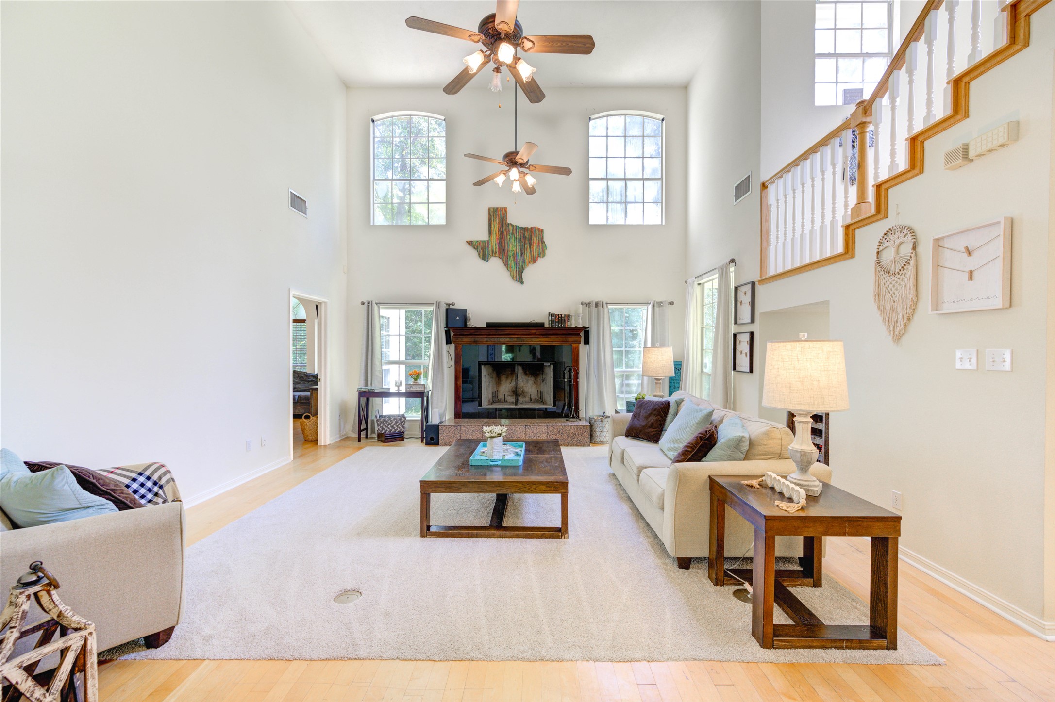 25903 Penguin Street Magnolia, TX 77355 - Photo 25 of 46 a living room with furniture a fireplace and chandelier