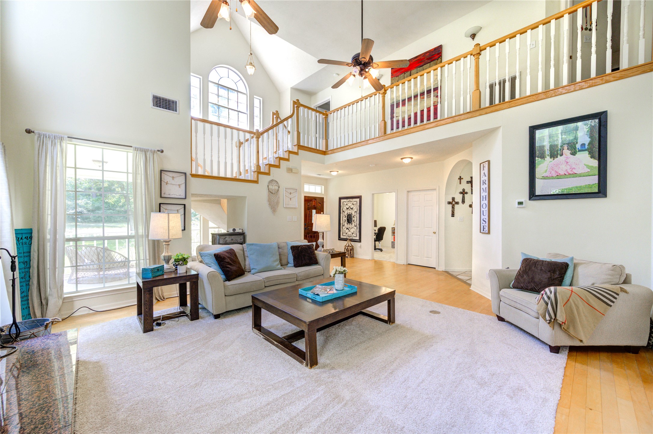 25903 Penguin Street Magnolia, TX 77355 - Photo 32 of 46 a living room with furniture rug and a large window