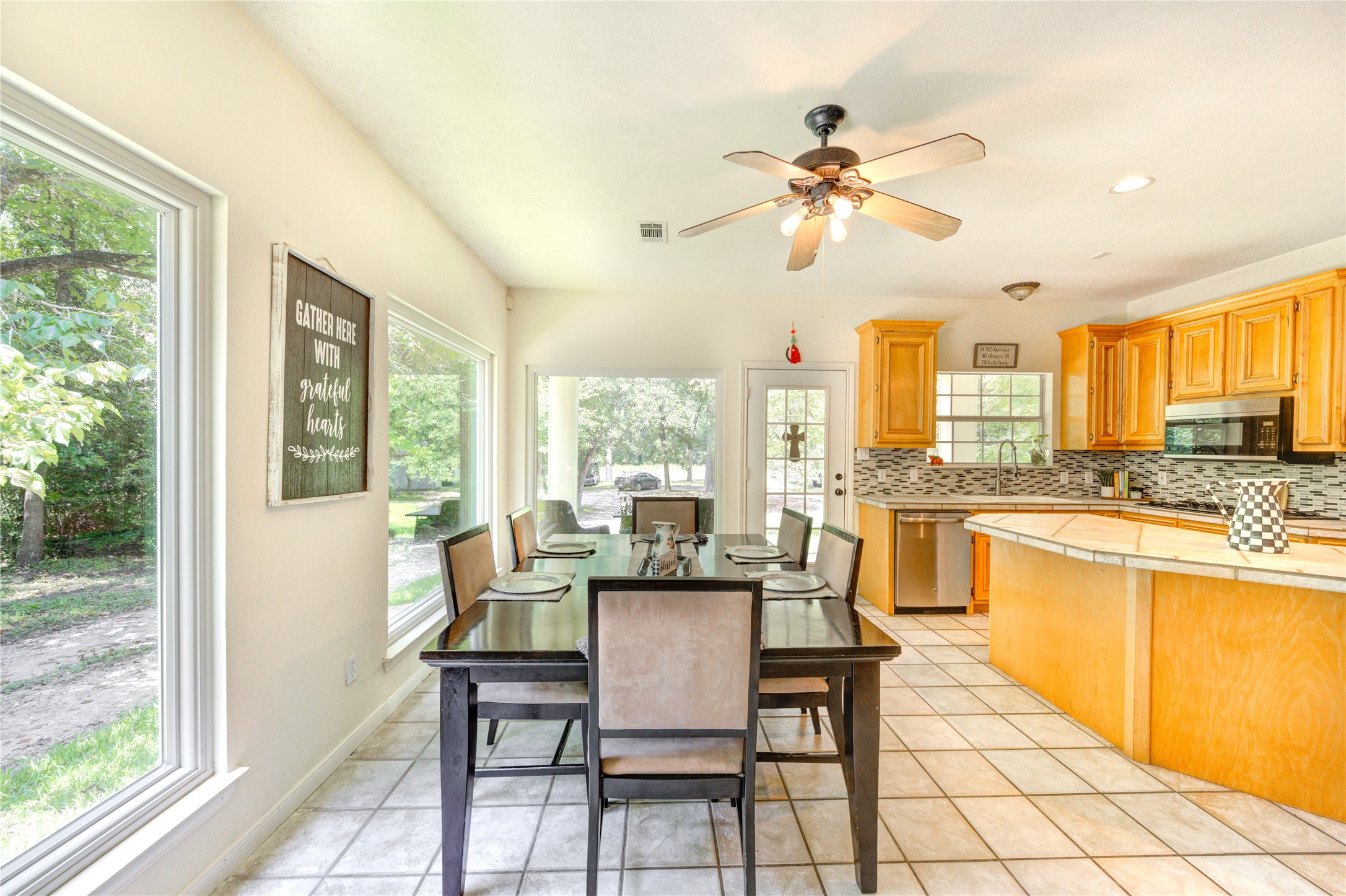 25903 Penguin Street Magnolia, TX 77355 - Photo 38 of 46 a dining room with furniture and a large window