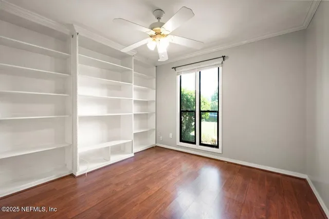 an empty room with fan