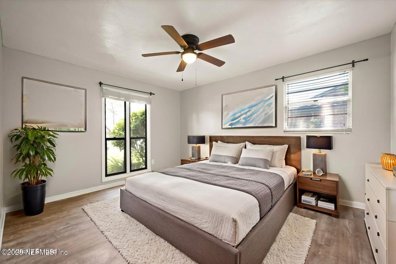 2477 Ridgecrest Avenue Orange Park, FL 32065 - Photo 20 of 28 a bedroom with a large bed and a large window